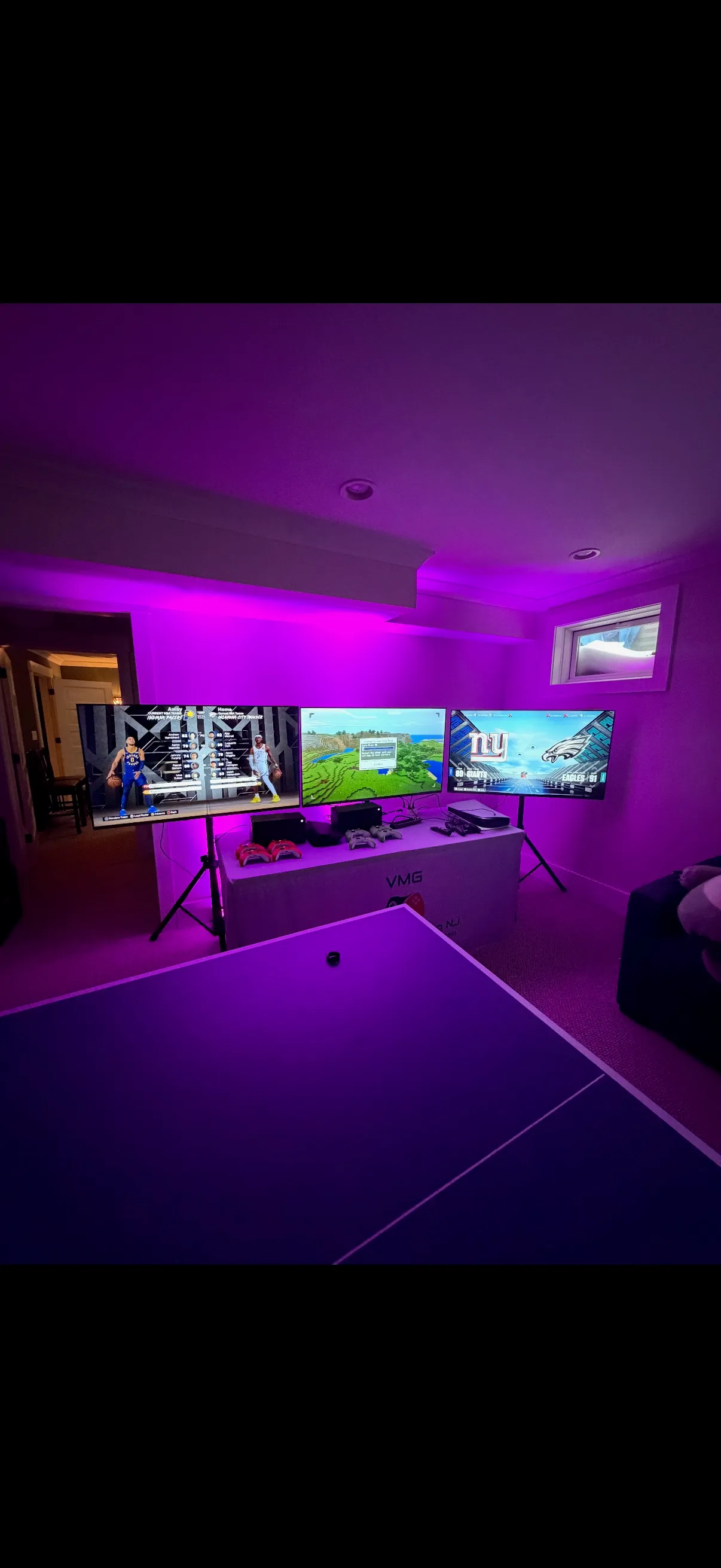 Indoor gaming party setup with HD screens
