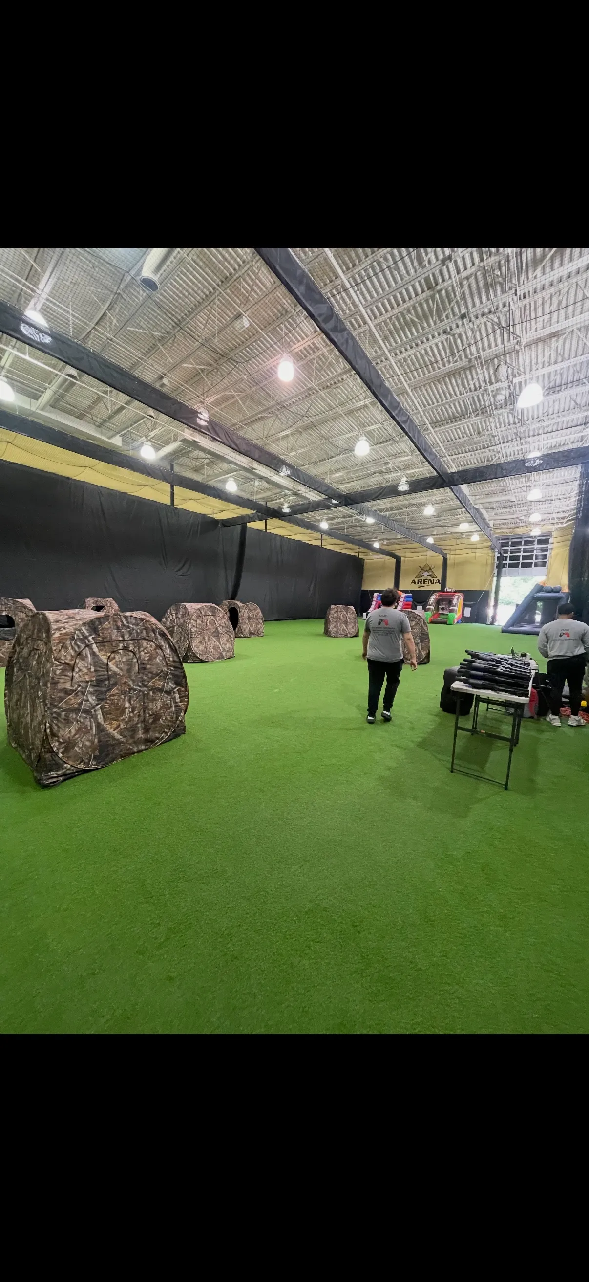 Laser tag battlefield setup with camouflage bunker tents