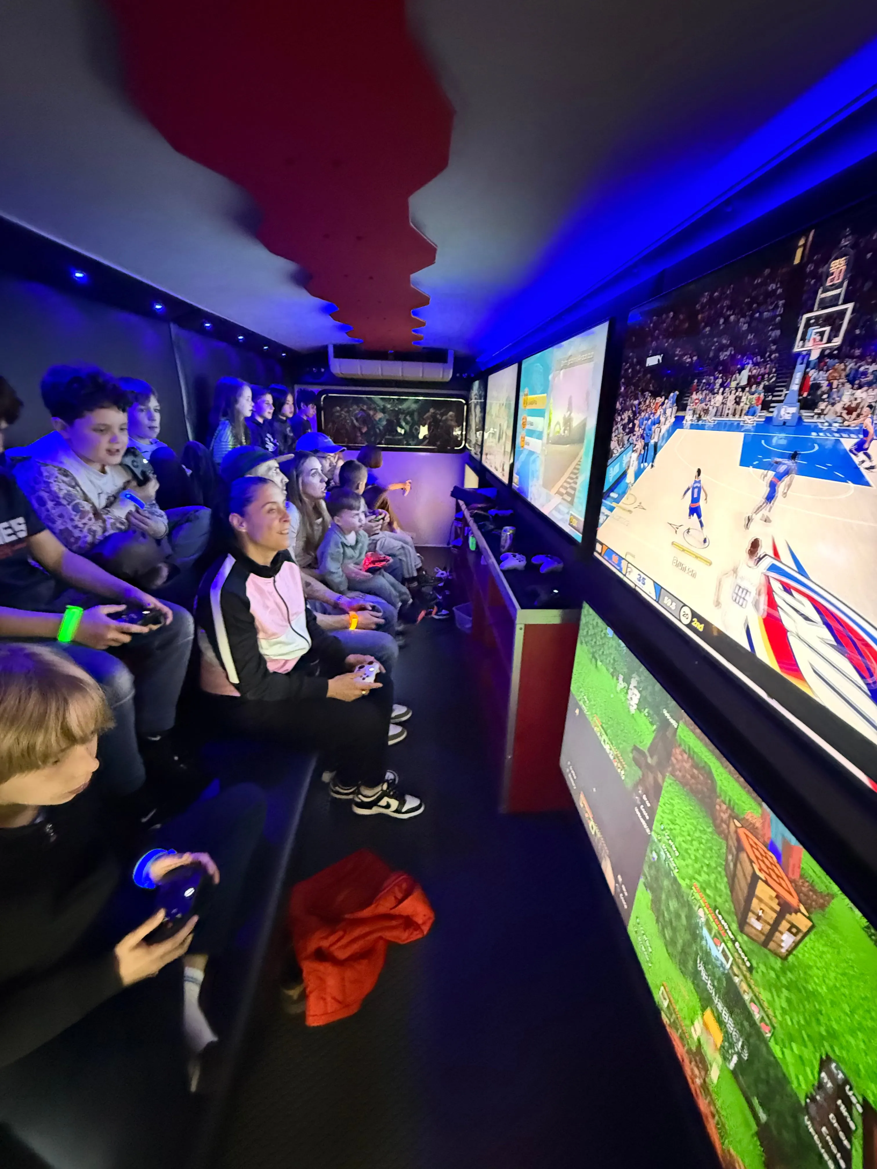 Kids playing inside the VIP gaming truck